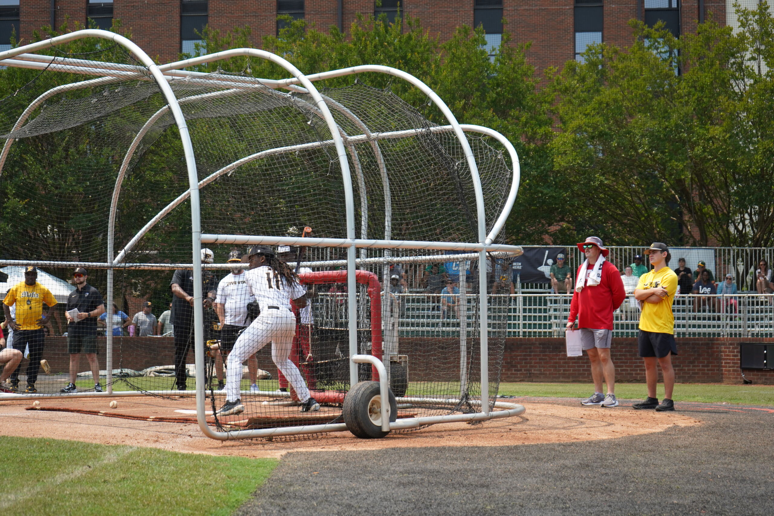Baseball prospect takes live BP in front of coaches and parents during Committed Baseball Showcase hitting evaluation.